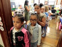 John B. Devalles elementary school second graders line up at the doorway to their classroom before heading to their next class, as students across New Bedford return to school.  [ PETER PEREIRA/THE STANDARD-TIMES/SCMG ] [ PETER PEREIRA/THE STANDARD-TIMES/SCMG ]